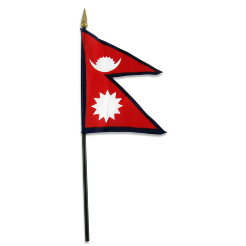 Nepal national flag on a black stick with golden spear tip, red field with white sun and crescent moon symbols.