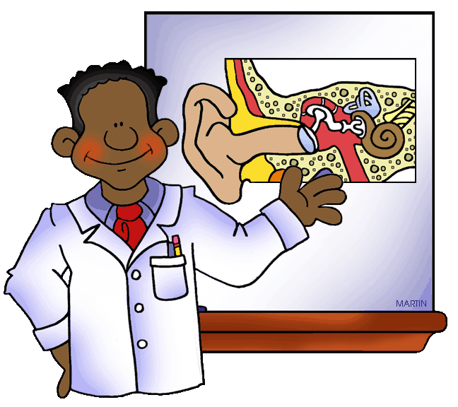 A smiling Black doctor in a lab coat points to an anatomical diagram of the human ear on a whiteboard.