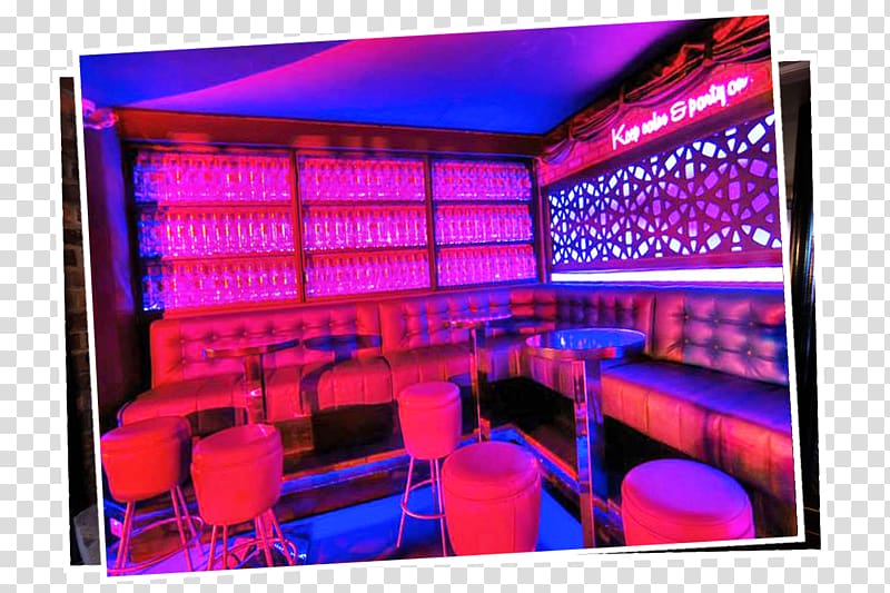 Vibrant neon-lit lounge with tufted leather booths, glass shelves, and modern bar stools under purple and blue lighting.