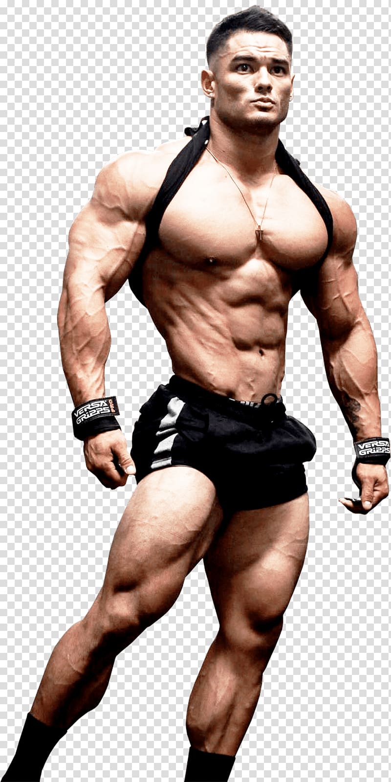 Muscular male bodybuilder posing shirtless with black shorts, wrist wraps, and a halter strap, showcasing defined abs and arms.
