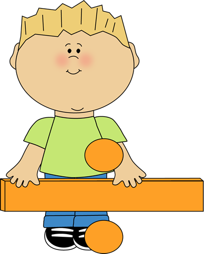 A smiling cartoon boy with blond hair, wearing a green shirt and blue pants, holding an orange block with two orange balls.