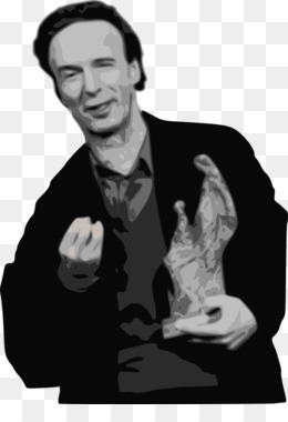 Man in dark suit holding a sculpted trophy, smiling subtly with expressive hand gesture.