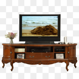 Vintage wooden TV stand with ornate carvings, holding a flat-screen TV displaying a beach scene and decorative items.