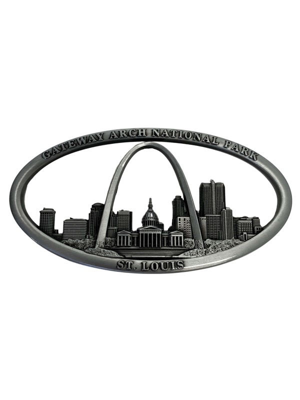 Metal souvenir ornament featuring the St. Louis skyline with the Gateway Arch and text "Gateway Arch National Park, St. Louis".
