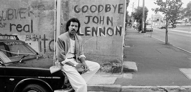 Iconic Black-and-White Photo of Man Beside “Goodbye John Lennon” Graffiti Wall