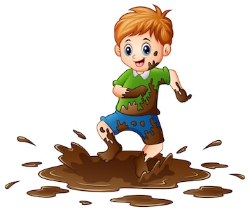 Happy boy with red hair jumping joyfully in a muddy puddle, clothes splattered with mud.