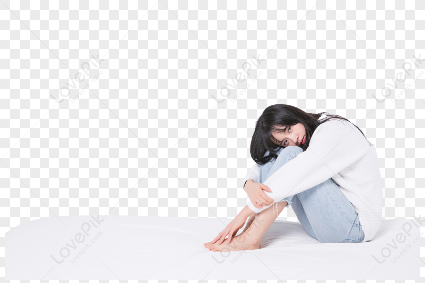 Sad Woman Sitting on Bed - Emotional Expression Stock Image