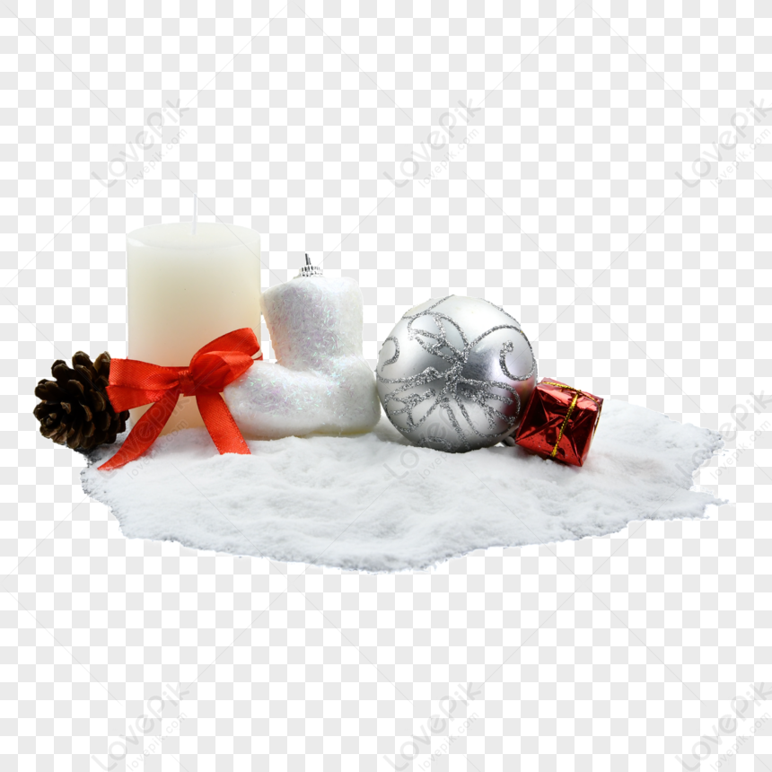 Festive Christmas arrangement with white candle, pinecone, red ribbon, silver ornament, and gift on snowy base.