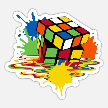 Colorful Rubik's Cube surrounded by vibrant paint splashes and drips on a white background.