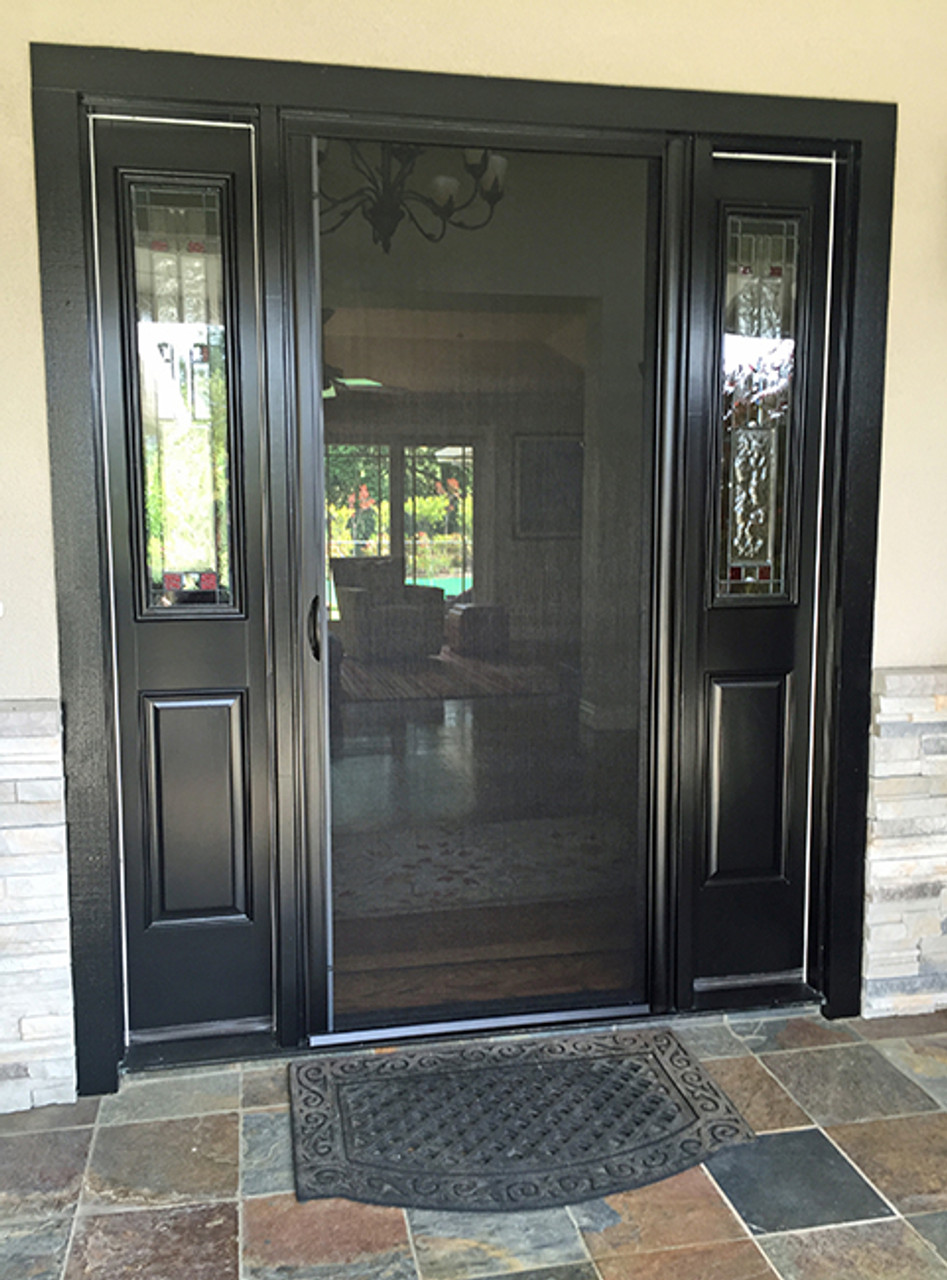 Black entry door with decorative glass sidelights and retractable screen door, set in stone-trimmed exterior wall.