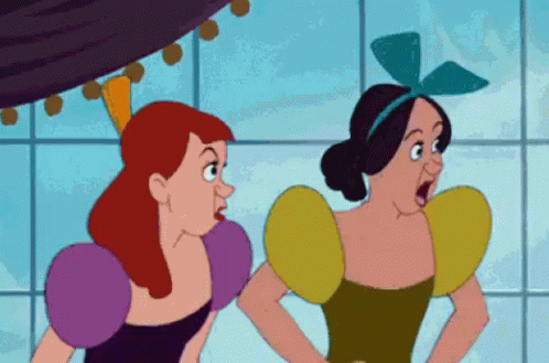 Two animated women in colorful Renaissance-style dresses reacting with surprise indoors.