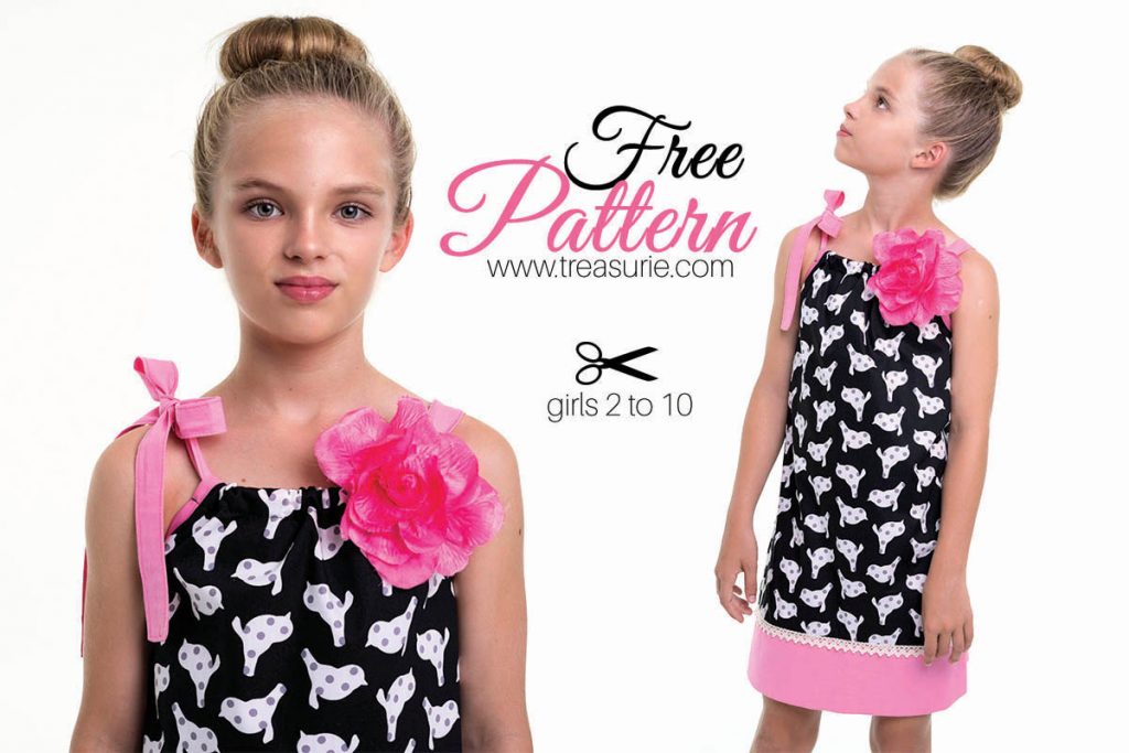 Girl modeling a black-and-white patterned dress with pink floral accent and tie straps; free sewing pattern for ages 2-10.
