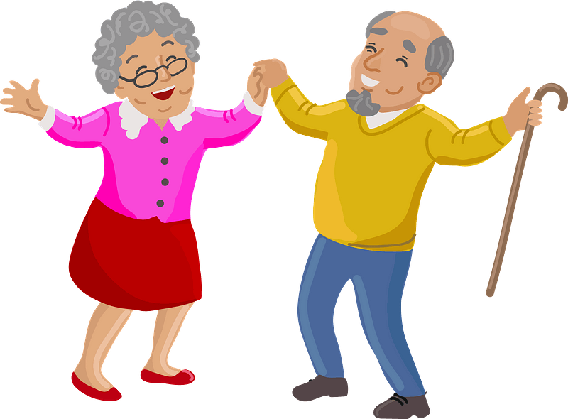 Happy elderly couple dancing joyfully; woman in pink cardigan and red skirt, man in yellow sweater holding cane.