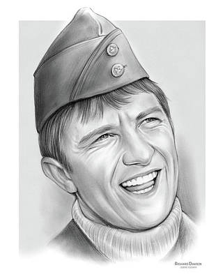 Pencil sketch portrait of a smiling young man in a military-style cap and turtleneck sweater.
