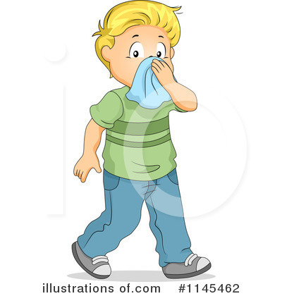 Young blond boy in green shirt and blue jeans wiping nose with blue tissue, walking forward.