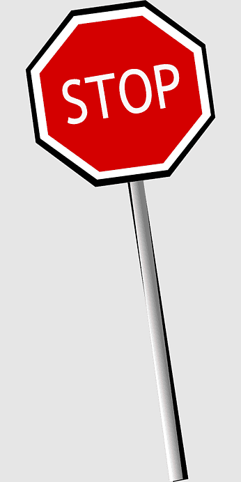Red octagonal stop sign with white "STOP" text and white border on a gray background.