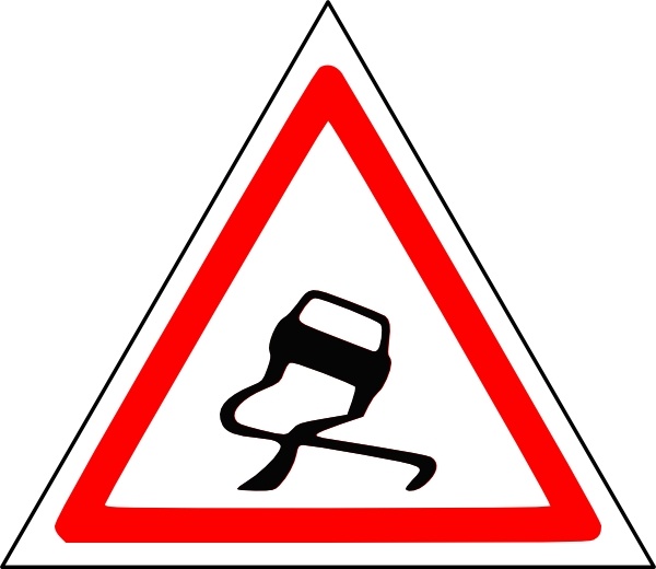 Red-bordered triangular warning sign depicting a black silhouette of a horse-drawn carriage.