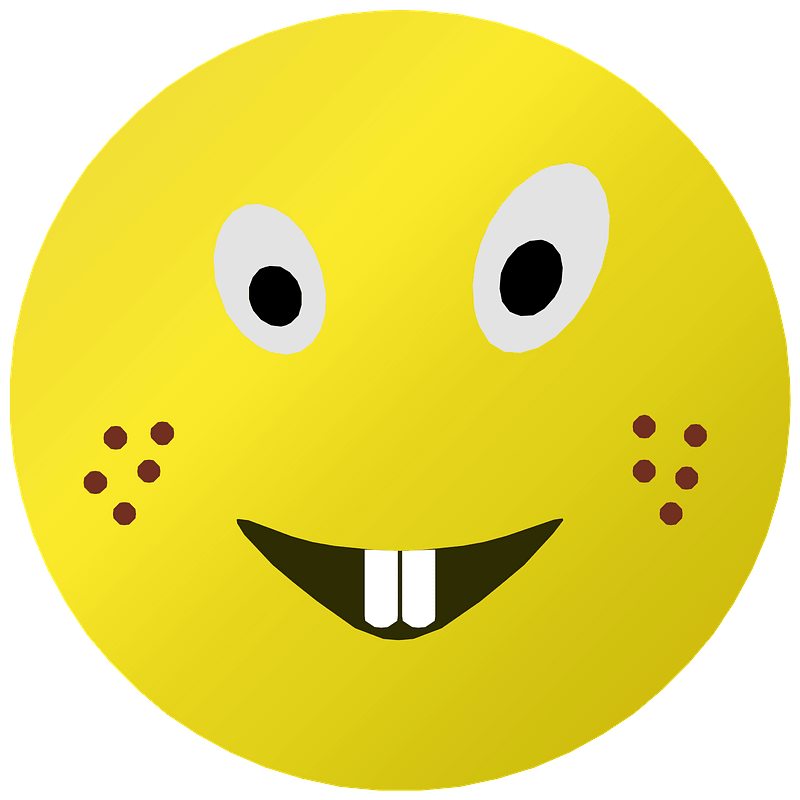Yellow emoji face with wide eyes, two front teeth, and brown freckles on cheeks.