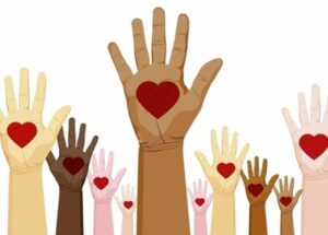 Diverse hands raised with red hearts in palms, symbolizing unity, love, and inclusion.