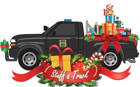 Black police pickup truck decorated with Christmas gifts, ribbons, candy canes, and a "Staff a Track" banner.