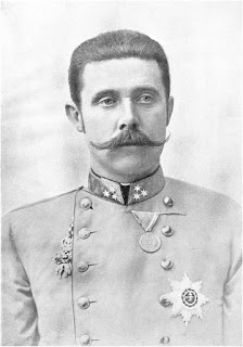 Portrait of a mustachioed Austro-Hungarian military officer in formal uniform with medals and insignia, early 20th century.