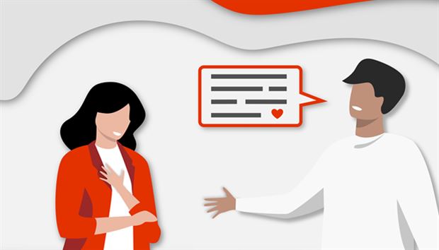 A man and woman in a friendly conversation with a speech bubble containing text and a heart icon.