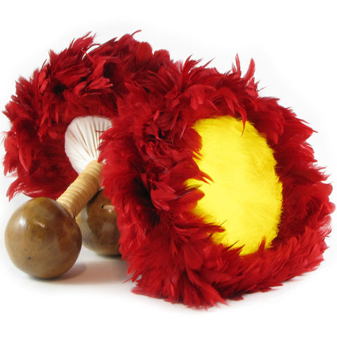 Two vibrant red feather maracas with yellow and white interiors and wooden handles, set against a white background.