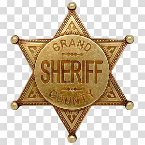 Golden seven-pointed sheriff's badge with "Grand County Sheriff" engraved on a circular center medallion.