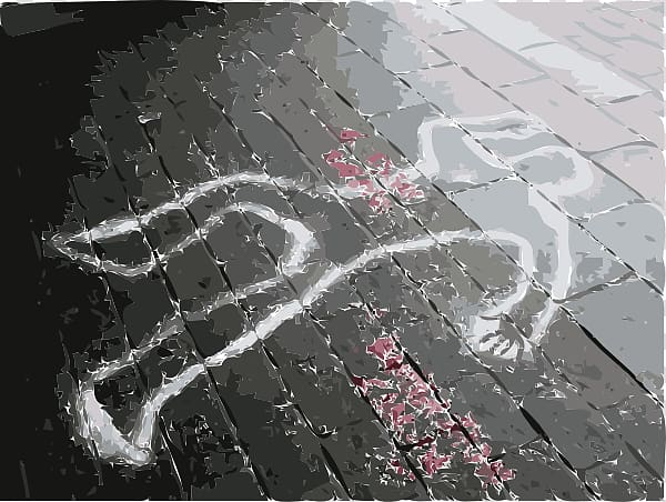 White chalk outline of a human figure on wet cobblestone pavement, with red smudges suggesting bloodstains.