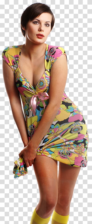 Woman in vibrant floral mini-dress with pink bow, yellow socks, posing confidently against transparent background.