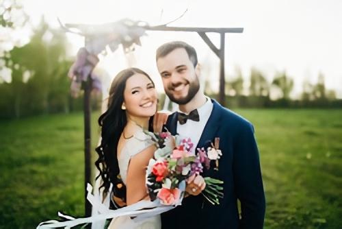 Rustic Outdoor Wedding Photography - Joyful Couple at Sunset Ceremony