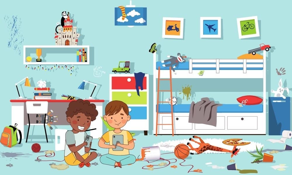Two children sit on a messy bedroom floor playing with tablets, surrounded by toys, food, and clutter near bunk beds and a desk.