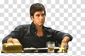 Al Pacino as Tony Montana seated at a desk with a gold-plated phone and glass of whiskey, intense expression.