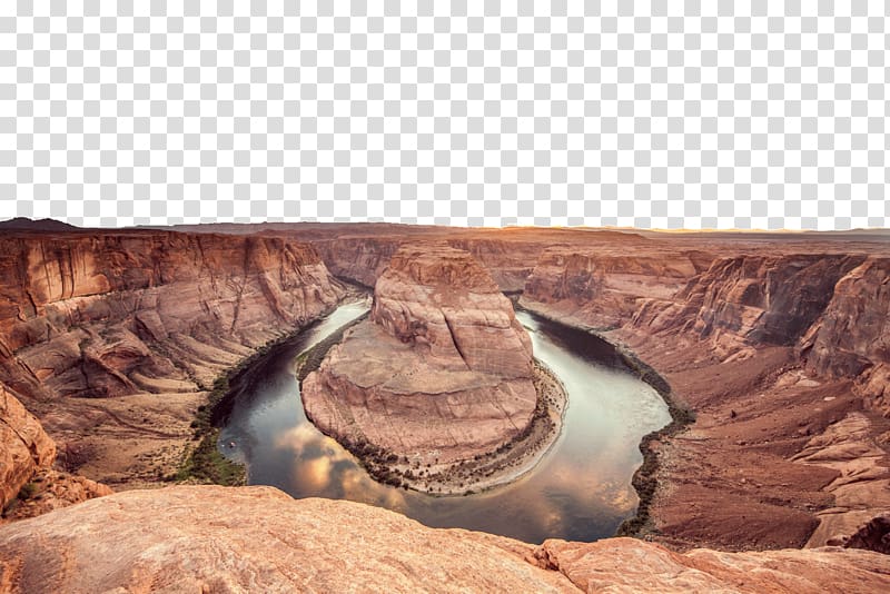Horseshoe Bend in Arizona at golden hour, showcasing the Colorado River’s dramatic U-turn through red sandstone cliffs.
