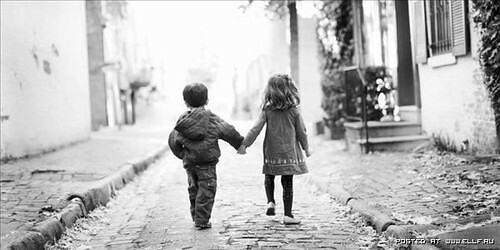 black and white kids holding hands