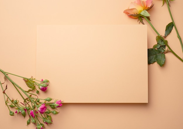 Premium Photo | Blank empty pink beige paper with fresh flowers ...