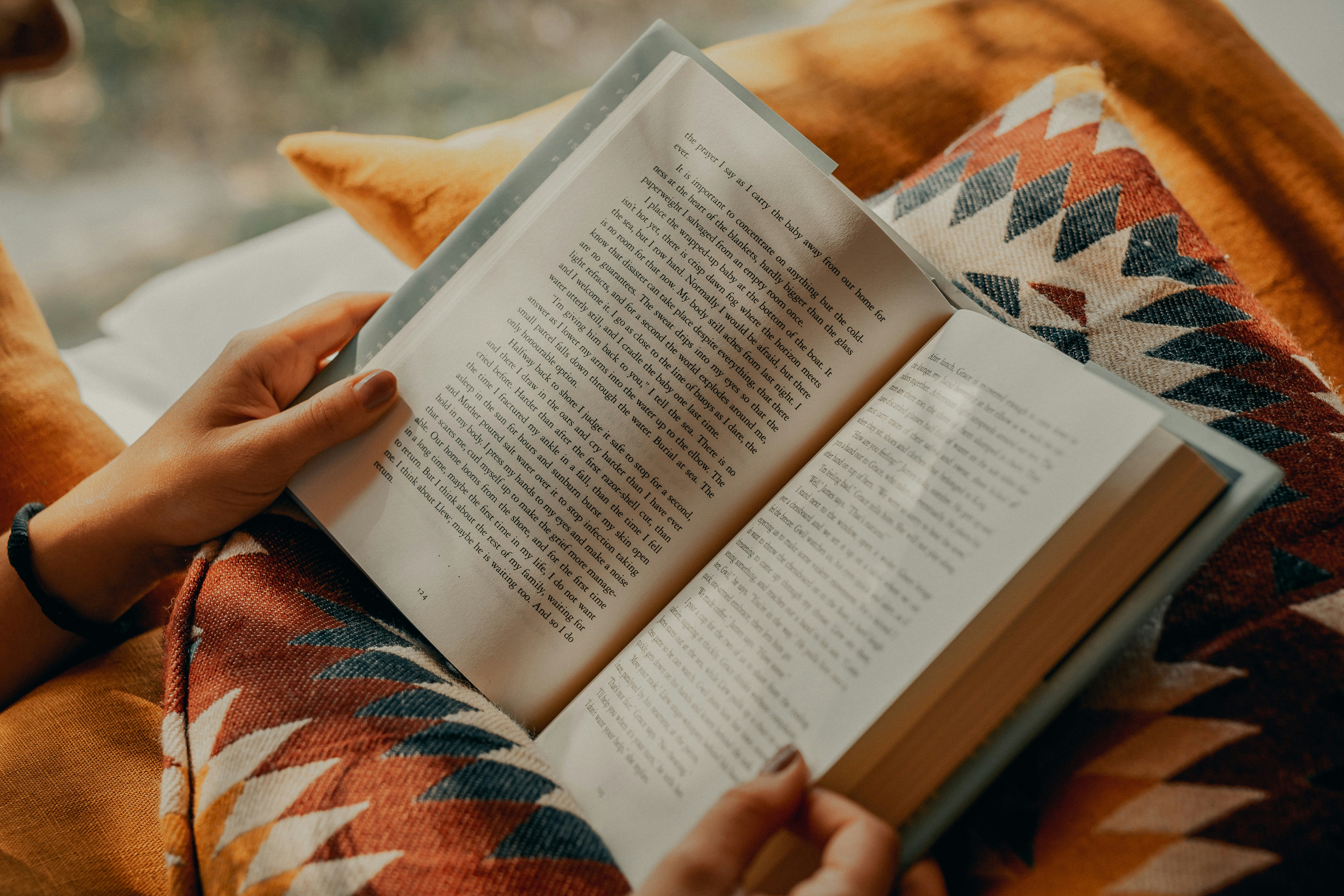 Person reading book on brown and beige textile photo – Free Book ...