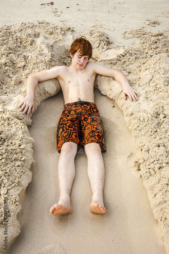 boy relaxing at the beach Stock-Foto | Adobe Stock