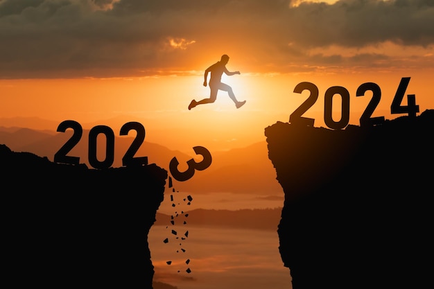 Premium Photo | Silhouette man jump happy new year 2024 concept ...