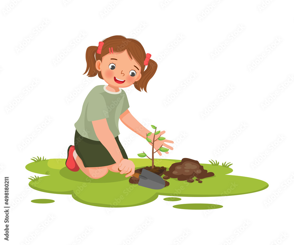 cute little girl with shovel planting young tree seedlings in the ...