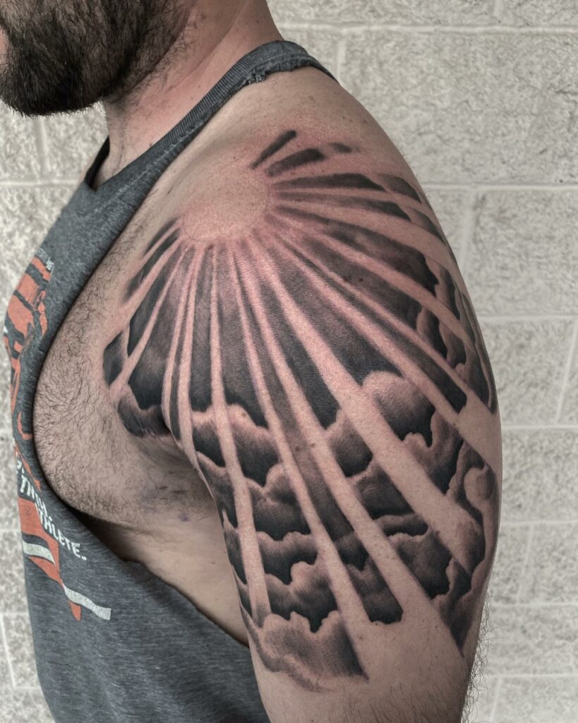 Clouds And Rays Tattoo