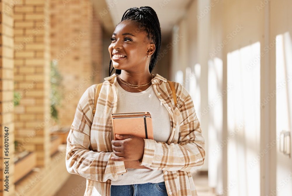 Black woman, college student and thinking about future with books ...