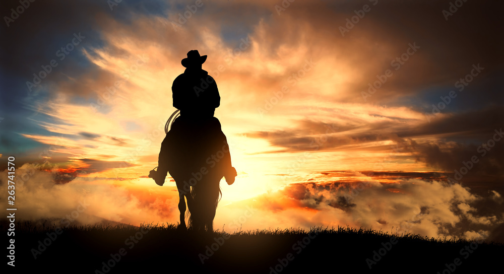 Poster, Wandbilder Cowboy on a horse at sunset, 40x22.2 cm