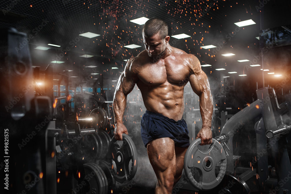 Poster, Wandbilder Muscular athletic bodybuilder fitness model posing after  exercises in gym, 40x26.7 cm