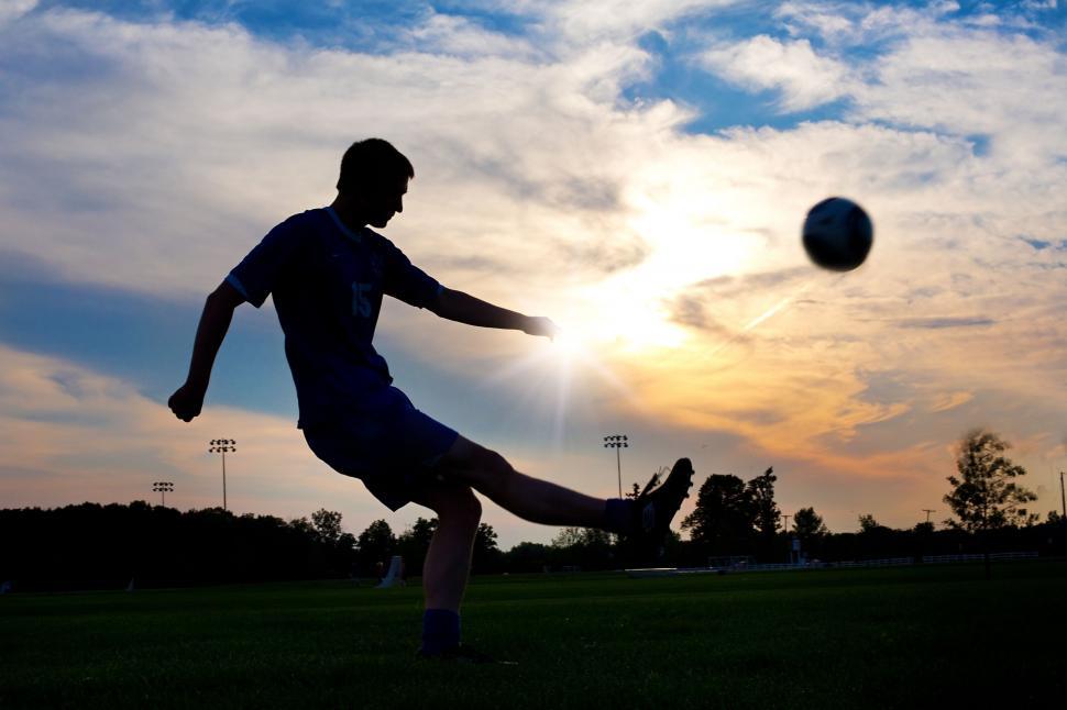 Free Stock Photo of Boy playing football in the sunset | Download ...