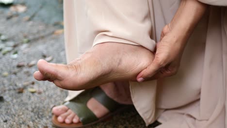 Young men feeling pain on feet ,