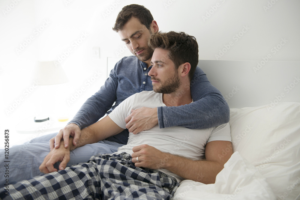 Gay Male Couple At Home Relaxing In Bed Together Stock-Foto ...