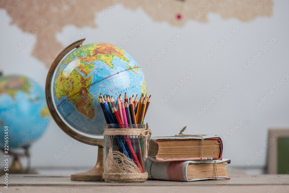 Poster, Wandbilder School background, books, globe and color pencils are on  the desk, 40x26.7 cm