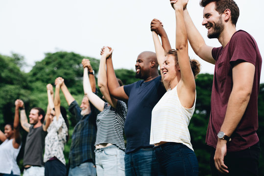 group of people holding hands