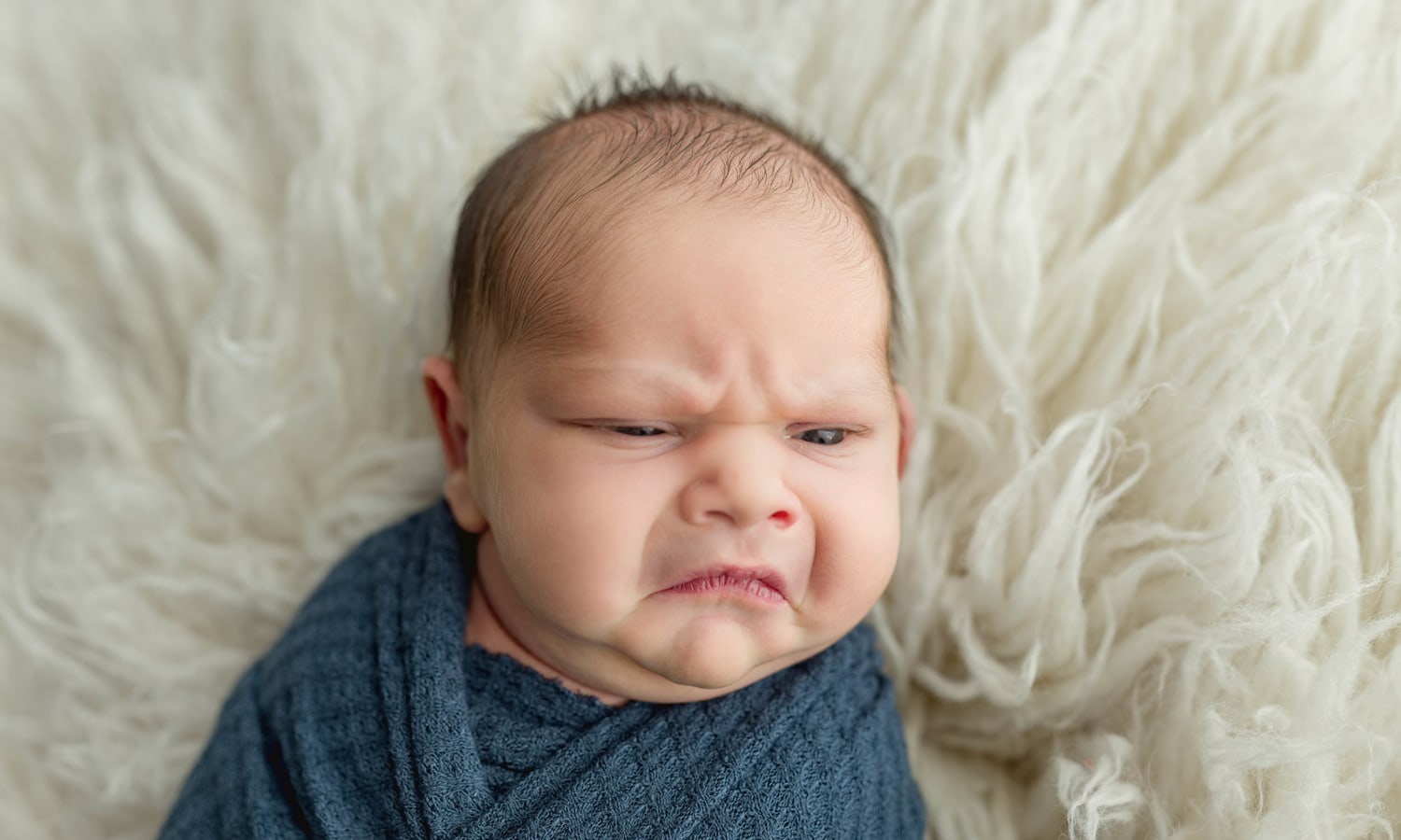 Newborn Baby Is Going Viral For His Many Grumpy Faces